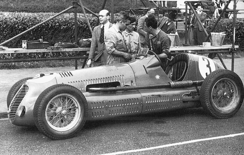 Vintage race car with team