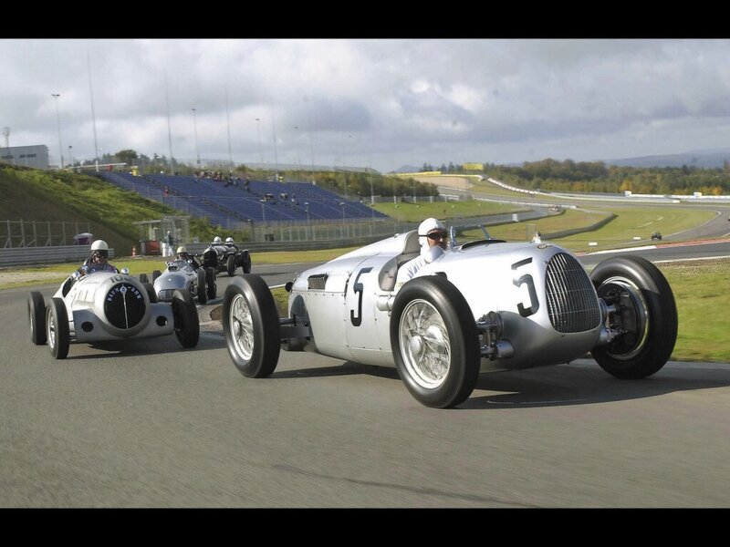 Vintage race cars on a track