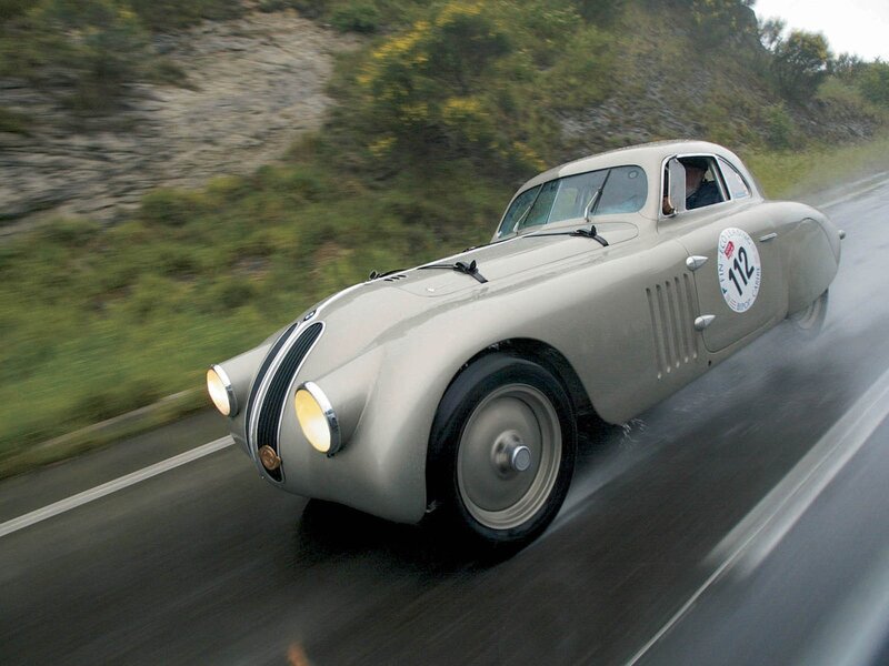 Vintage racing car on wet road