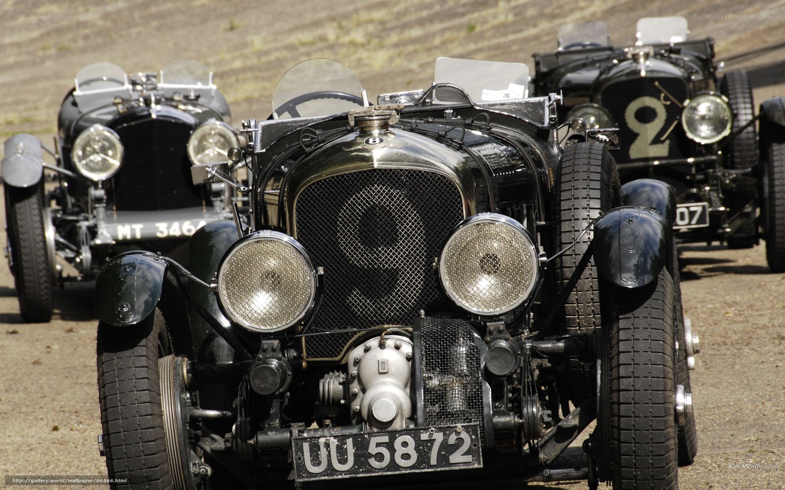 Vintage racing cars in formation