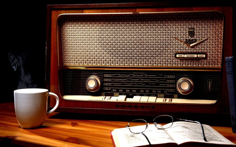 Vintage radio with coffee and book