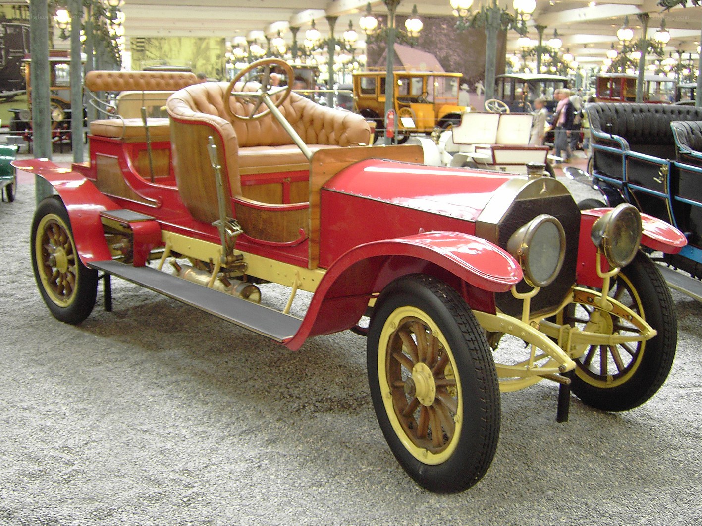 Vintage red automobile on display