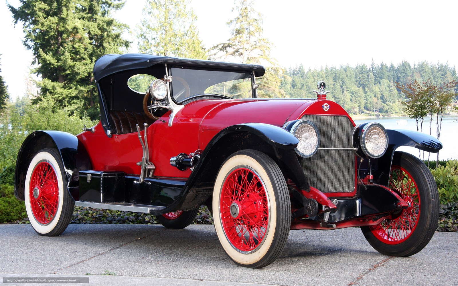 vintage red car by lake