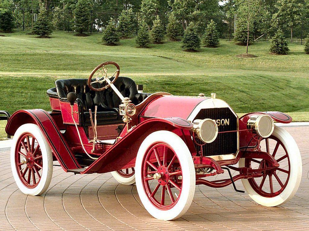 vintage red car on brick path