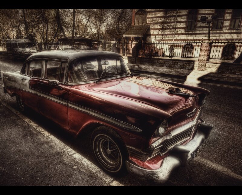 Vintage red car on city street