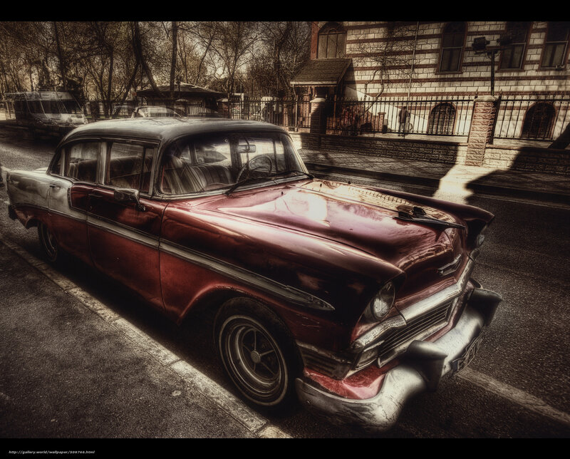 Vintage red car on city street
