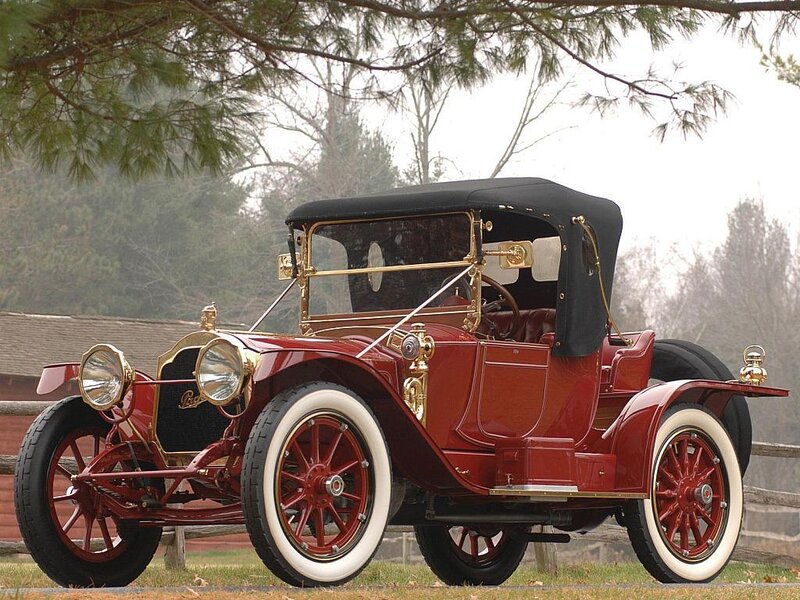 vintage red car with black top