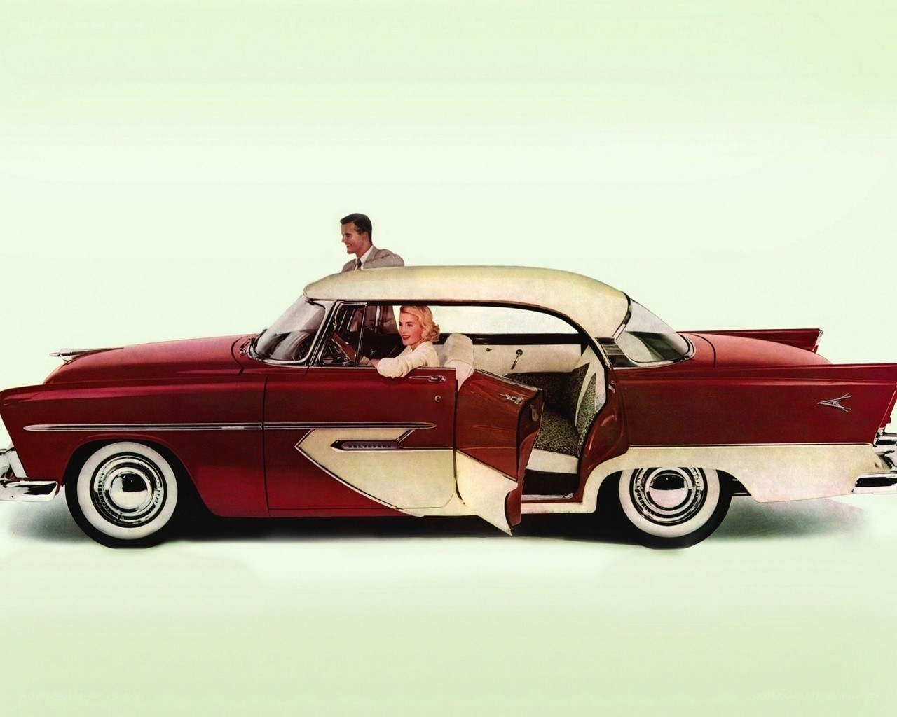 Vintage red car with couple