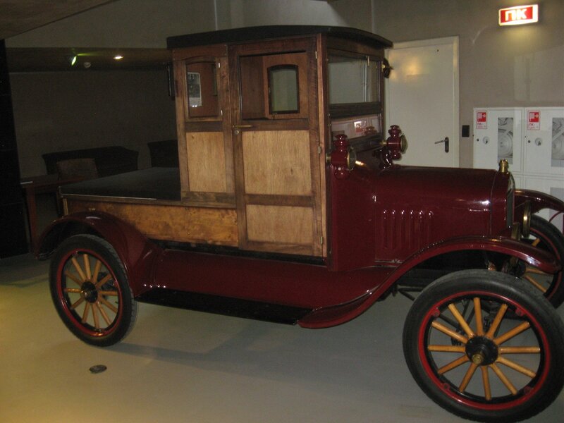 Vintage red car with wooden body