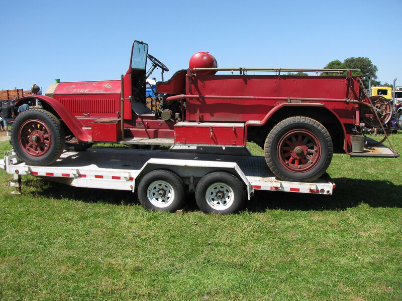 vintage red fire truck on trailer