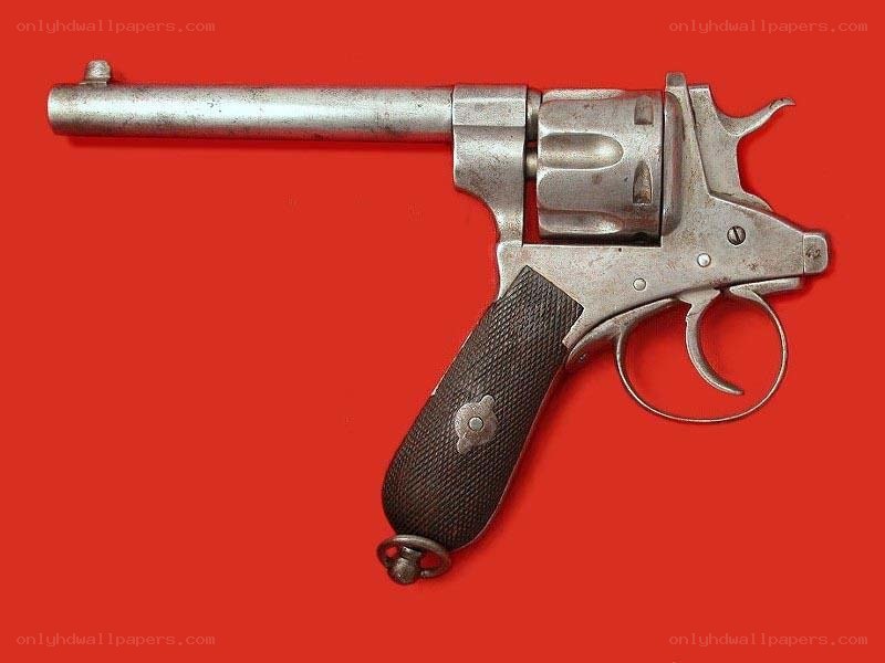 vintage revolver on red