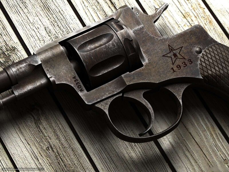 Vintage revolver on wooden surface