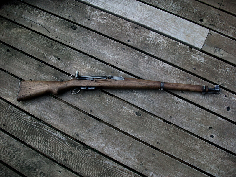 Vintage rifle on wooden deck