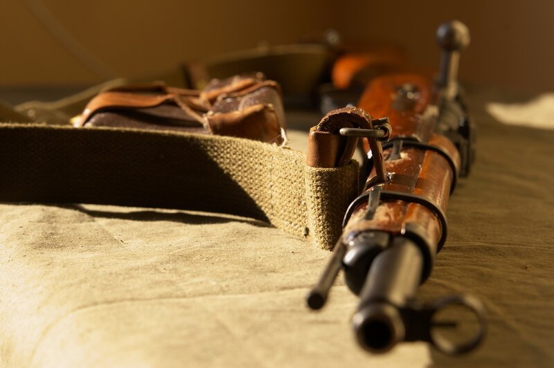 Vintage rifle with leather gear