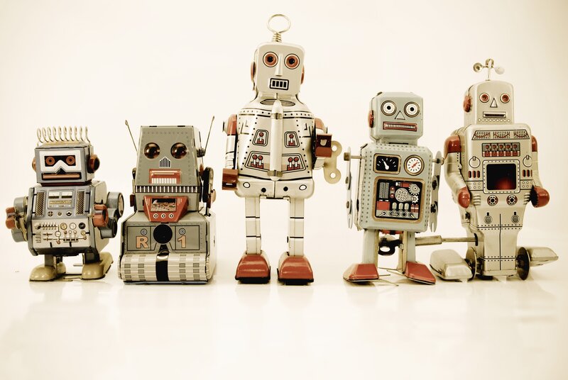 vintage robot toys in a row