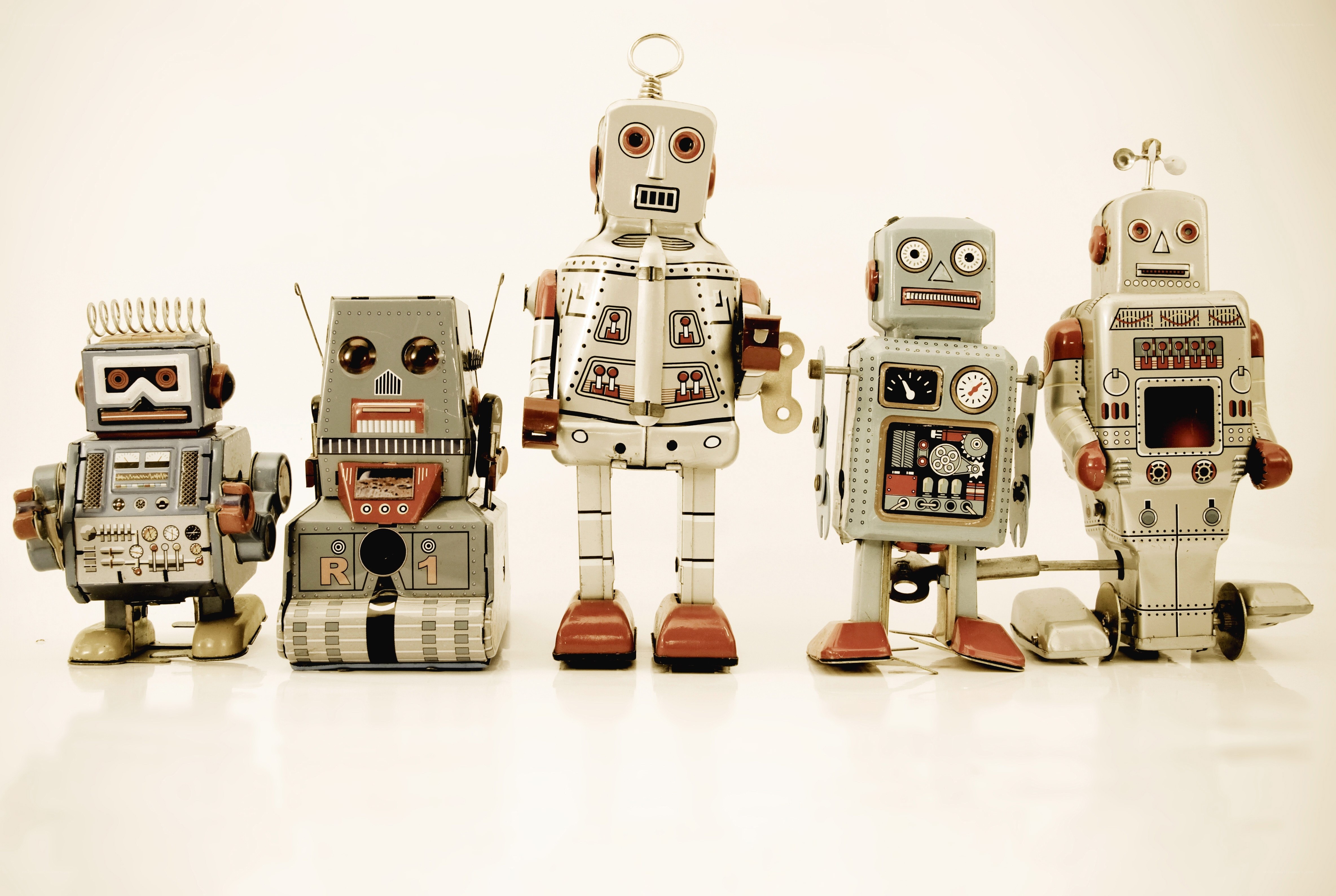 vintage robot toys in a row