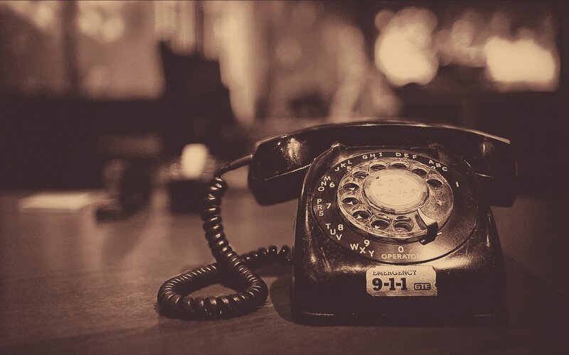 vintage rotary telephone on desk