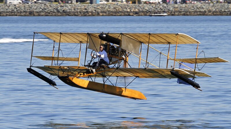 Vintage seaplane flying over water