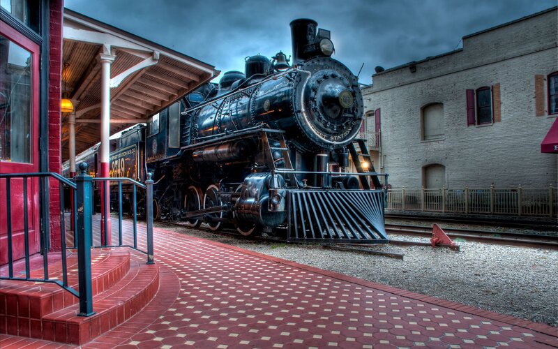 Vintage steam locomotive at station
