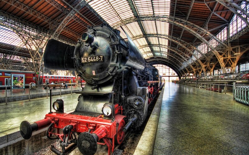 Vintage steam locomotive in train station
