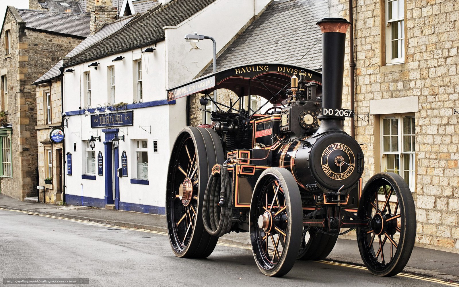 Vintage steam traction engine on street