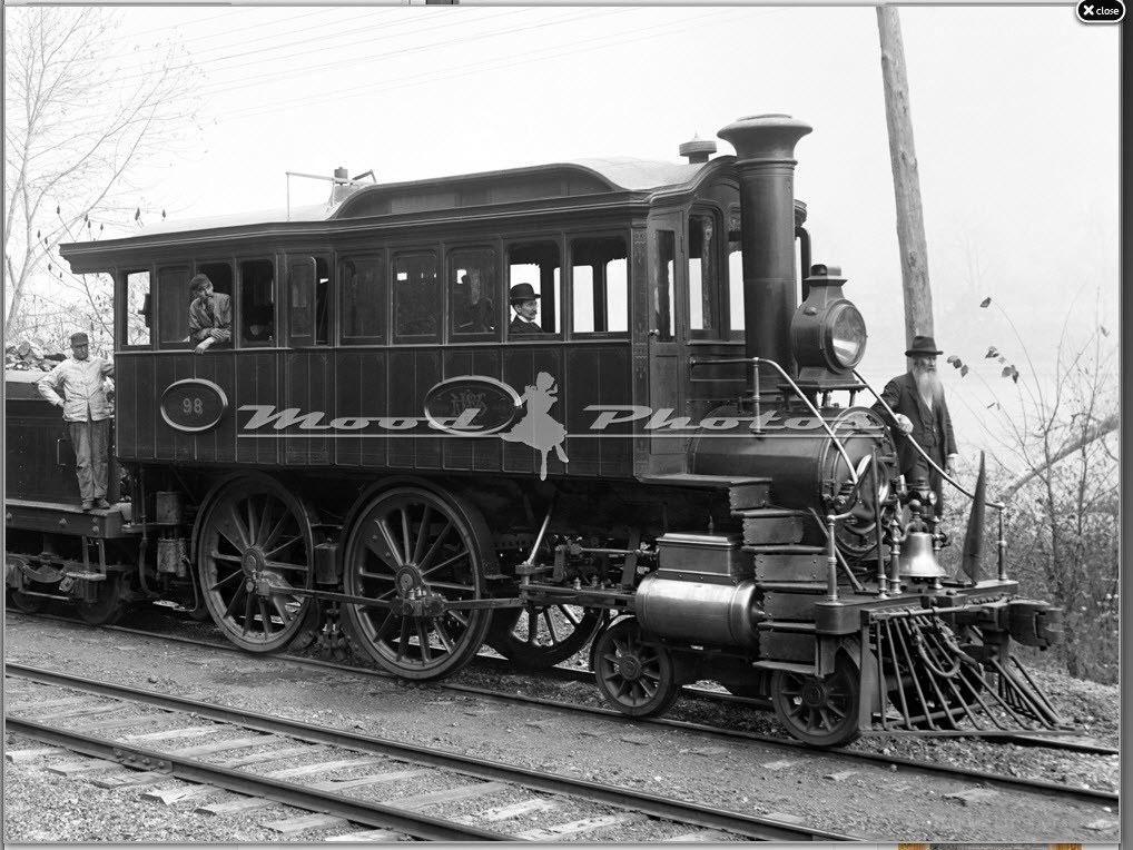 Vintage steam train on tracks