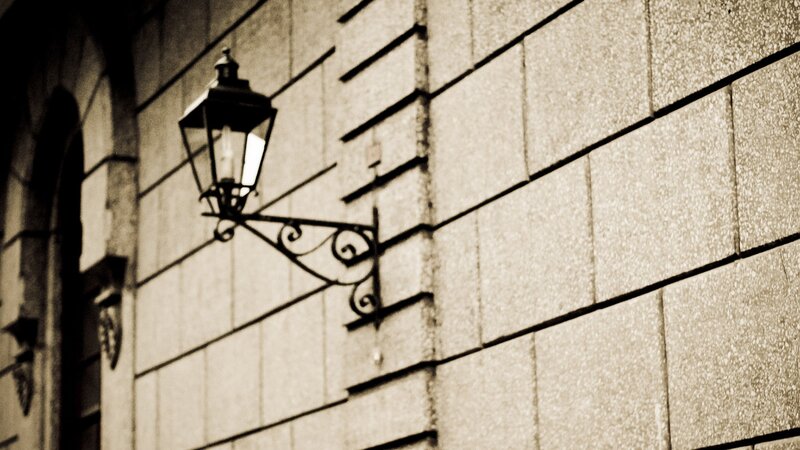 vintage street lamp on stone wall