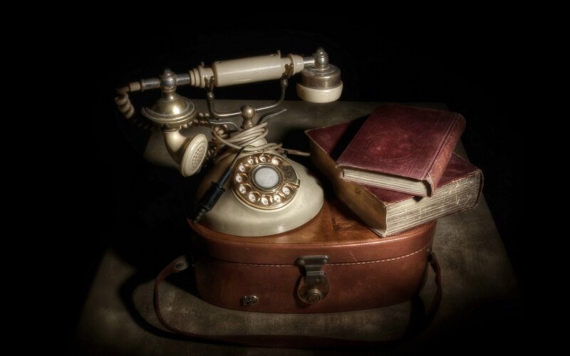Vintage telephone and books