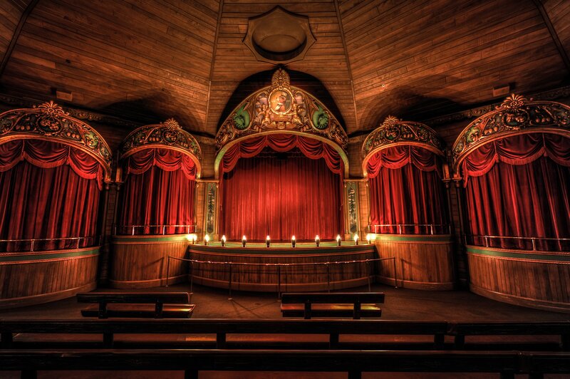 Vintage theater stage with red curtains