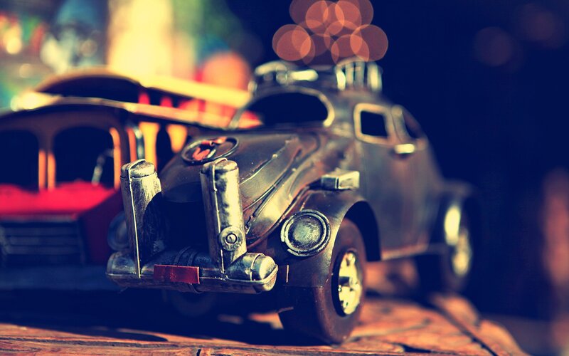 vintage toy car on wooden surface