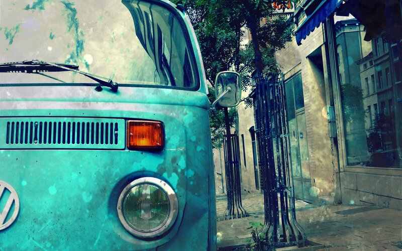 vintage turquoise van on city street