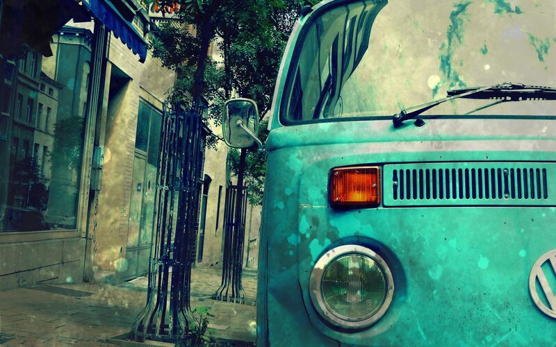 vintage turquoise van on city street