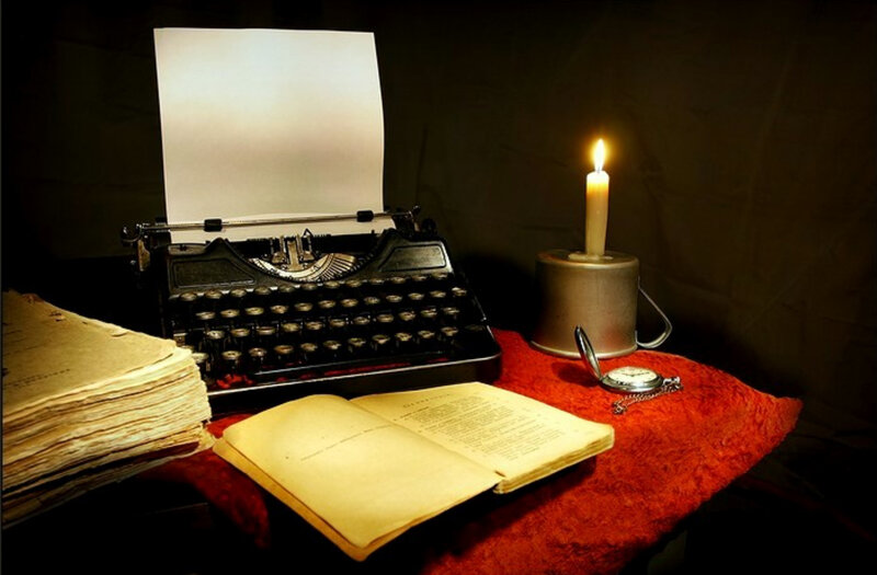 Vintage typewriter with candlelight
