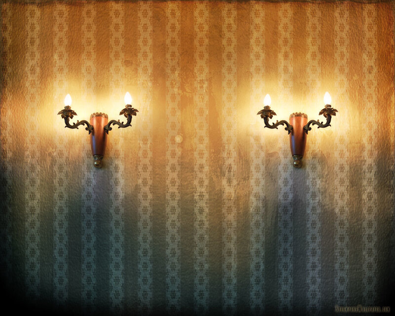 Vintage wall sconces on patterned wallpaper