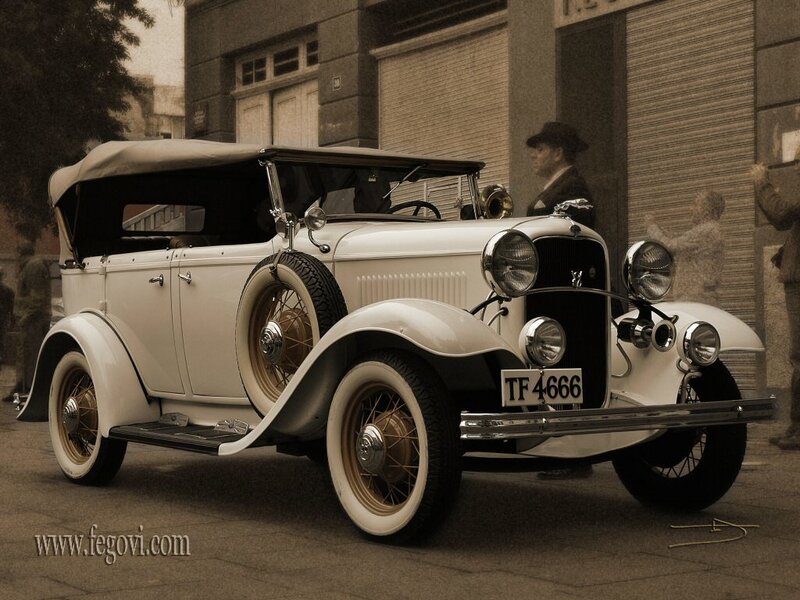 Vintage white car on city street