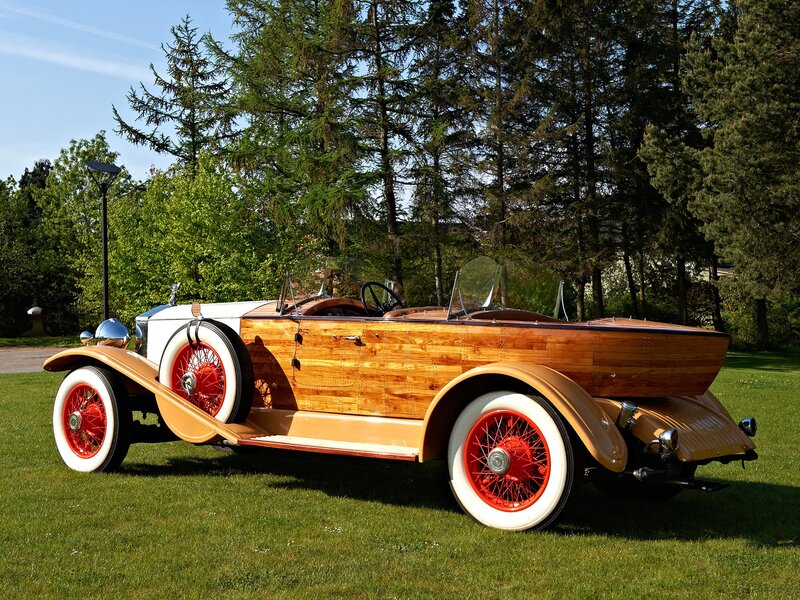 Vintage wooden car on grass