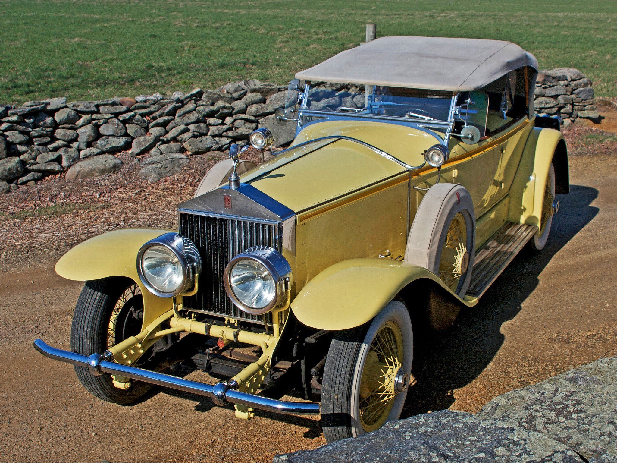 vintage yellow rolls-royce car