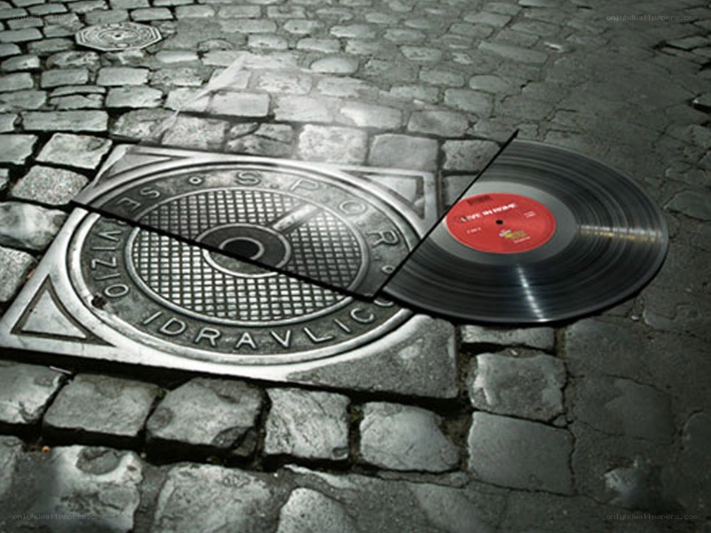 vinyl record on manhole cover