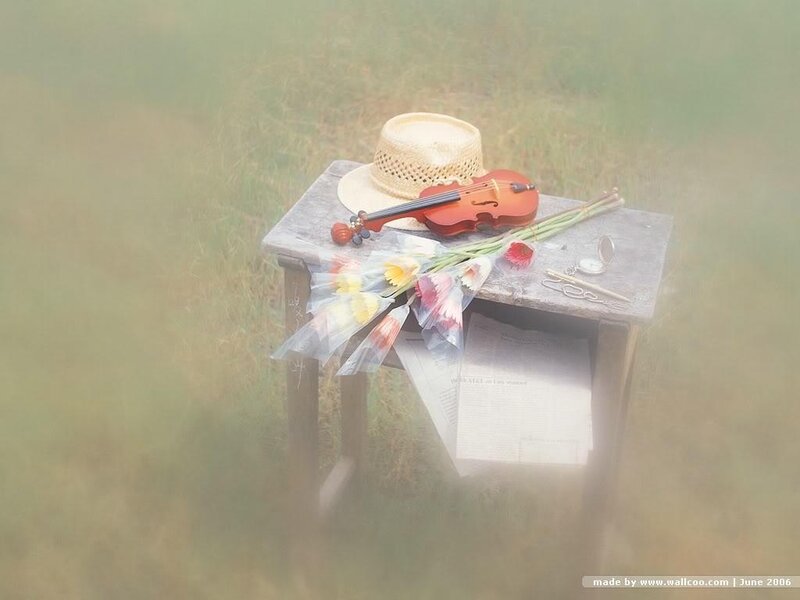 Violin and flowers on a table