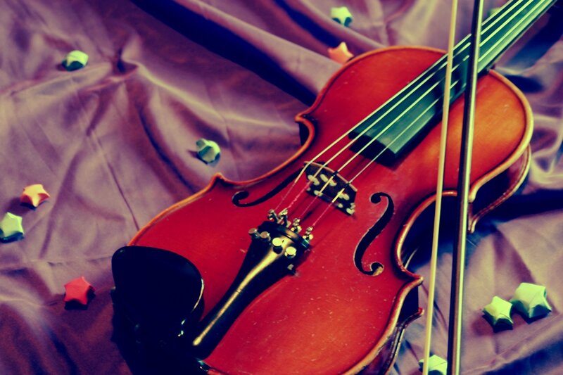 Violin on Purple Fabric