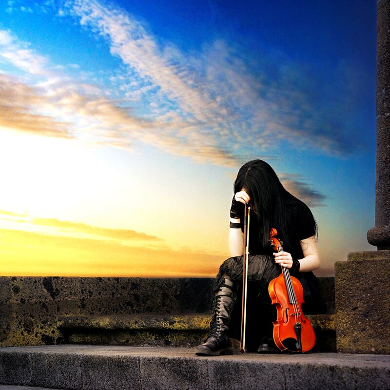 Violinist at sunset