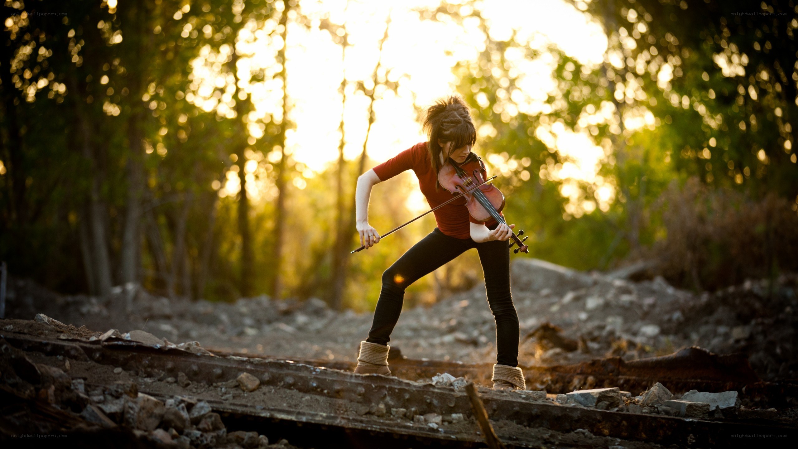 Violinist in a forest clearing