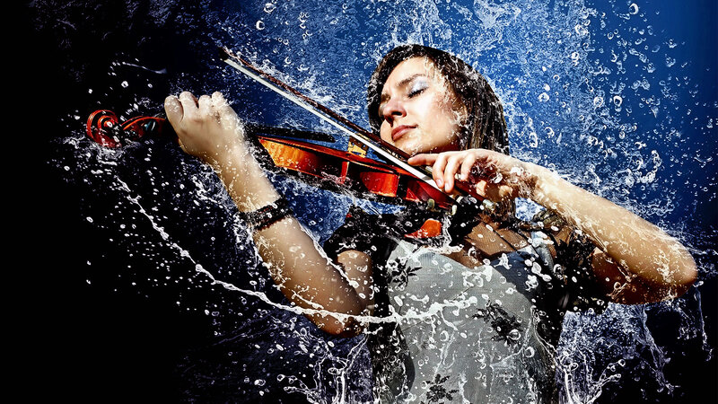 Violinist in water splashes