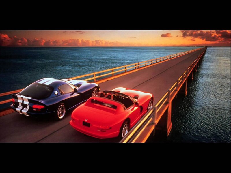 Viper cars on a bridge at sunset