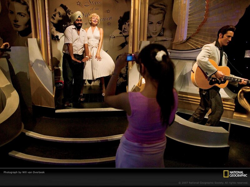 Visitors at a celebrity wax museum