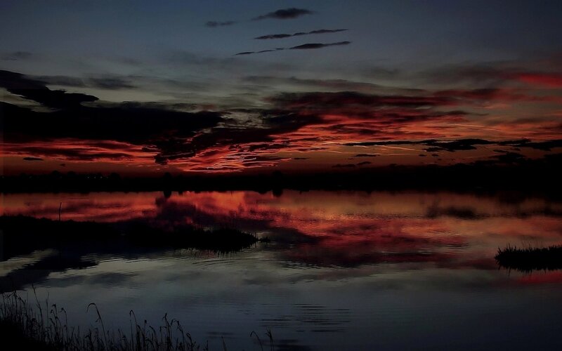 Vivid sunset over a calm lake