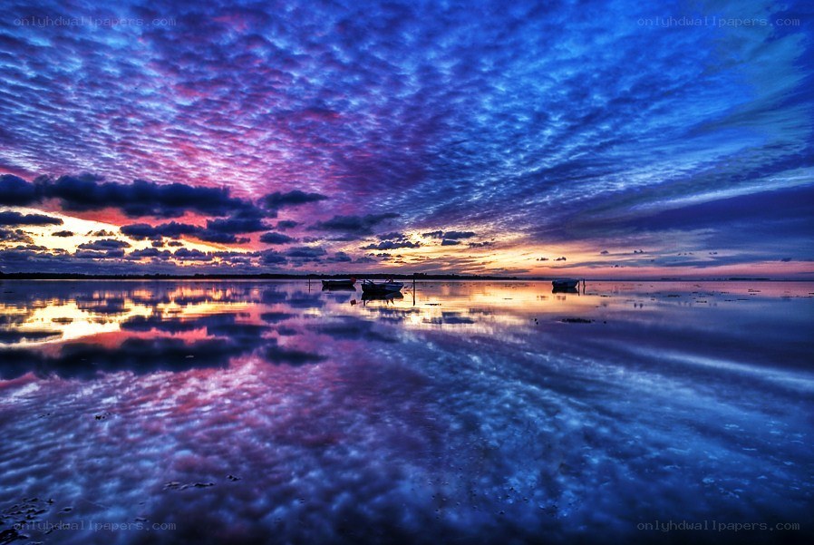 Vivid sunset over calm water