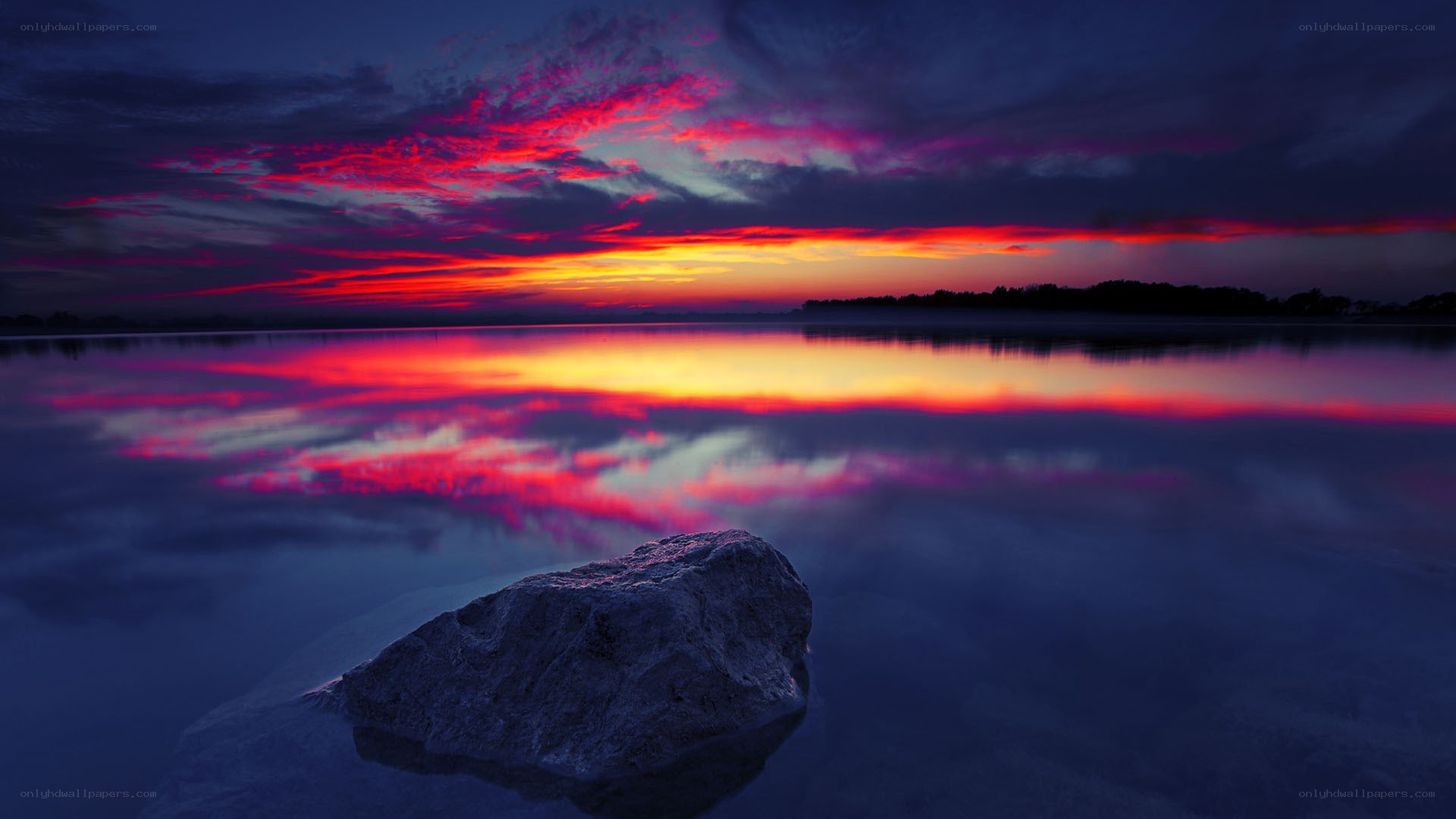 Vivid sunset over calm water