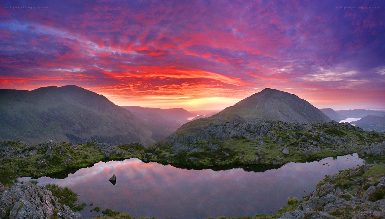 Vivid sunset over mountain lake