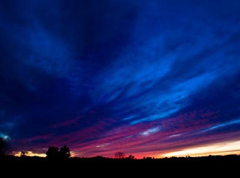 vivid sunset with purple and blue clouds